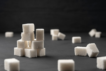 Sugar cubes on a black background.