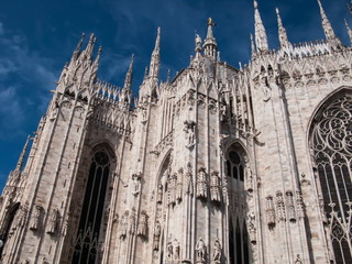 Fototapeta premium Duomo di Milano on background of blue sky at sunny day, Milan, Lombardy, Italy