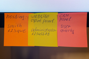A very weak and widespread password is written on a sticker / stick note attached to a computer...