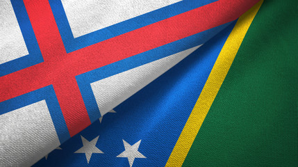 Faroe Islands and Solomon Islands two flags textile cloth, fabric texture
