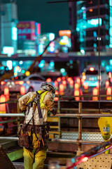 Fototapeta premium construction worker at night Tokyo Japan