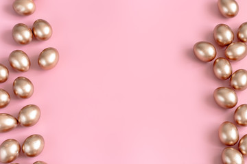 Background with Easter eggs in gold color.