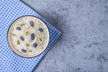 Сurd on a plate with raisin, honey, pumpkin seed. Healthy breakfast Cottage cheese