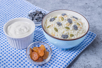 Сurd on a plate with raisin, honey, pumpkin seed. Healthy breakfast Cottage cheese
