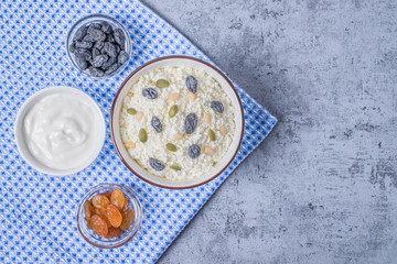 Сurd on a plate with raisin, honey, pumpkin seed. Healthy breakfast Cottage cheese
