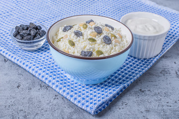 Сurd on a plate with raisin, honey, pumpkin seed. Healthy breakfast Cottage cheese