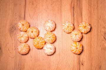 New Year symbol made of tangerines, background for the new year