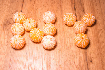 New Year symbol made of tangerines, background for the new year