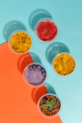 Appetizing natural desserts on a bright colored background