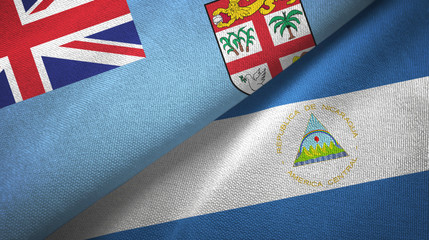 Fiji and Nicaragua two flags textile cloth, fabric texture