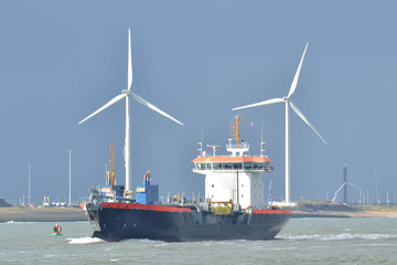 windmills and boat in Nieuwe Waterweg near beach Hoek van Holland