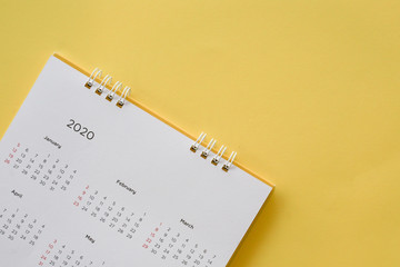 close up top view on white calendar 2020 month schedule to make appointment meeting or manage...