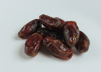 Dried dates on a white background. Dried fruits