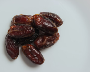 Dried dates on a white background. Dried fruits