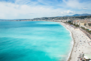 Fototapeta na wymiar View of the beach in the city of Nice, azure shore Mediterranean sea, France 