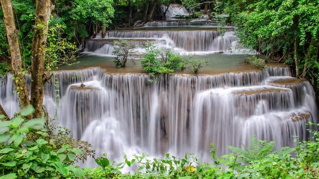 4K Timelapse of beautiful waterfall in tropical rain forest, soft water of the stream in the natural park at Huai Mae Khamin Waterfall in Kanchanaburi, Thailand.