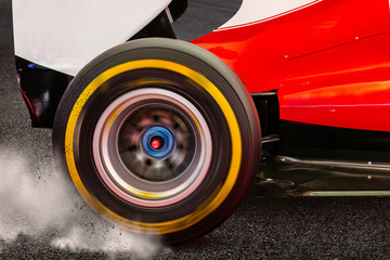Formula 1 Rear wheel spinning and drifting after launch on a dark asphalt with smoke and dirt...