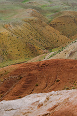 Red sandy slopes of canyon. Corrosion the soil after drought and global warming. Lack of water in stone desert
