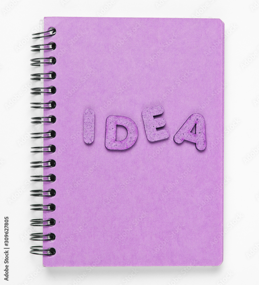 Poster i have an idea! notebook with craft paper with word idea on white background.