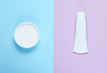 Minimalistic oral hygiene concept. Tube of toothpaste, tooth powder on a pastel background. Teeth...