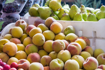 Apricot and pears for sale in a street food market: Colombia.
