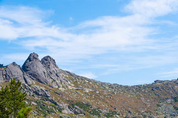 rock ridge under blue cloudy sky, mountain tourism, tourist area for relaxation