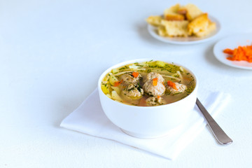 Vegetable hot soup with pasta, meat meatballs and dill