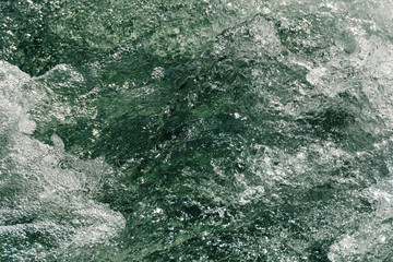 Rough water of sea surf. The water boils in rapid flow of river