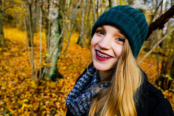 portrait of young woman in autumn park