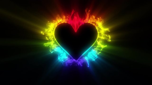 Iridescent multicolored heart shaped Valentine's Day particle love burst. Vivid rainbow colored glowing smoke. Romantic lovely logo copy space gas animation. Isolated on black alpha copyspace 4k 60fps