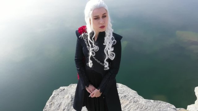 Beautiful girl in a blonde wig and a fantasy costume. Mother of dragons.