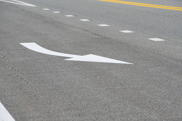 section of dry asphalt road with road markings