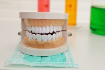 denture and glass of water