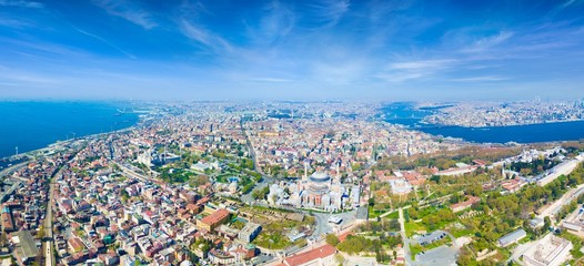 Aerial panoramic view of historical center of city and famous landmarks in Istanbul, Turkey. Blue Mosque and Hagia Sophia in Sultanahmet district of Istanbul.
