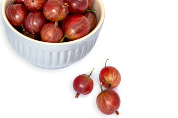 red gooseberries on white background