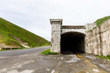 Fototapeta na wymiar tunnels on the pass in caucasus mountains. Georgian Military Road. Kudskoe or Gudskoe gorge. Jvari pass near the ski resort Gudauri.