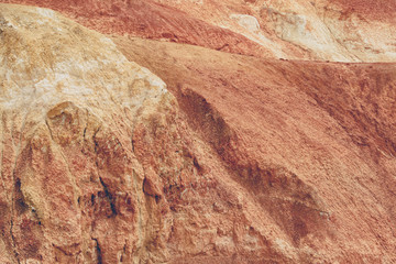Naklejka premium Red canyon in hills. Soil erosion following drought, climate change and formation of gullies. Lack of water in dry steppe