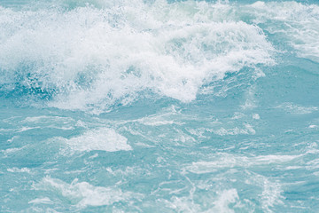 Fototapeta premium Blue ocean waves, tide. Swift current of river
