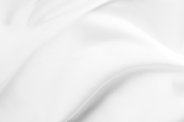 Fototapeta premium Abstract white fabric texture background. Cloth soft wave. Creases of satin, silk, and cotton. 