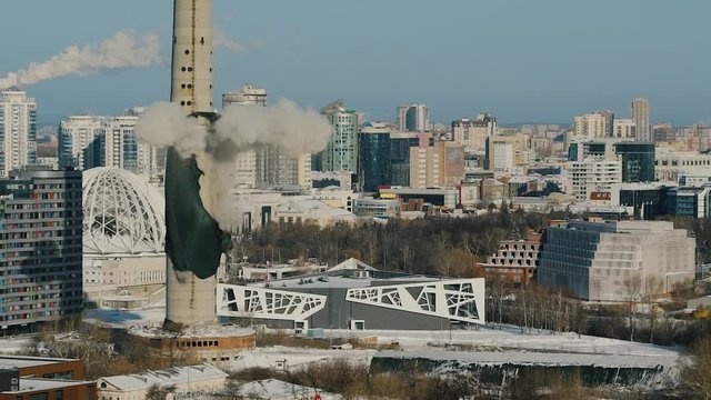 Controlled explosion of abandoned television tower in Ekaterinburg, scattering concrete dust. Demolution old concrete TV tower in 24 of March 2018.