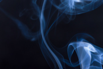Colourful smoke fumes in different patterns on a black isolated background. Print for t-shirt.