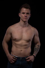 Fototapeta premium portrait of a beautiful strong young muscle man