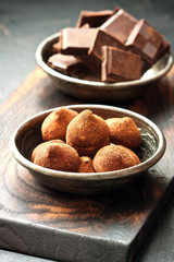 Homemade truffle candies on wooden board