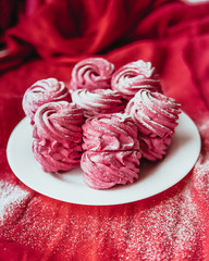 Handmade air russian fruit pink marshmallow on a pink background. Homemade Sweets.