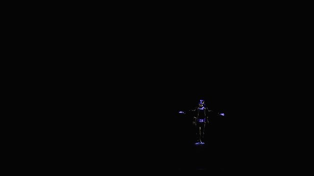 Dancer in a LED costume with a book