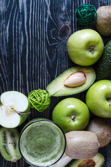 fruit and greens smoothie in clear glass healthy food concept top view