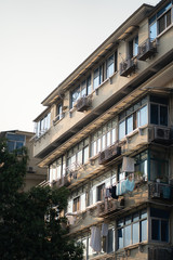 Fototapeta premium Asian Apartment building with laundry drying
