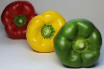 colorful peppers on wooden background