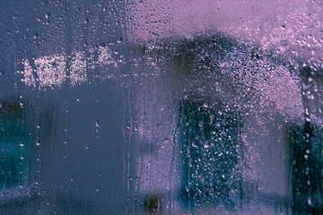 Window glass with drops and blurs
