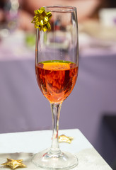 Christmas cocktail in a glass with a gold bow